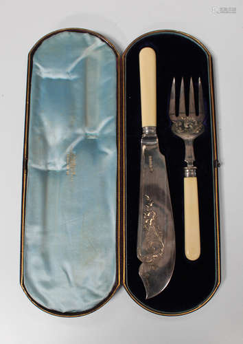 A pair of late Victorian silver fish servers, Sheffield 1882 by Henry Wilkinson & Co, cased.Buyer’