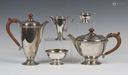 An Irish silver four-piece tea set, comprising teapot, hot water pot, milk jug and sugar bowl,