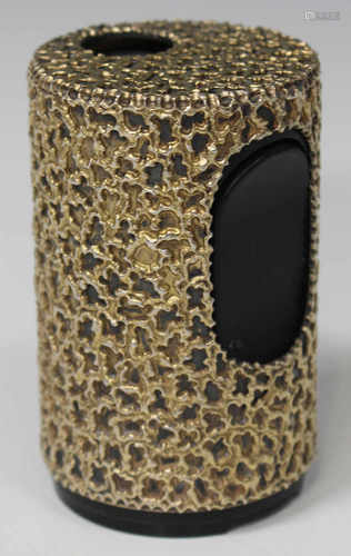 A Stuart Devlin silver gilt cylindrical table lighter sleeve with abstract textured decoration,