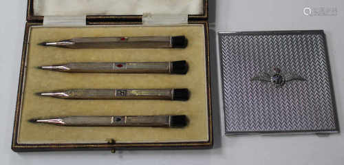 A set of sterling silver Bridge propelling pencils, each enamelled with a different card suit,