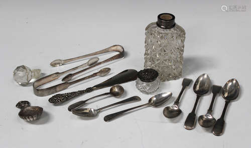 An Elizabeth II silver caddy spoon with scallop shell bowl and scallop shell tab handle,