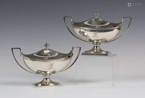 A pair of George III silver oval boat shaped sauce tureens, each domed cover with an urn shaped