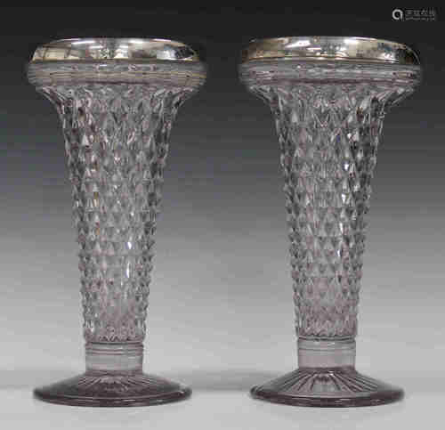 A pair of George V silver mounted glass vases of flared trumpet shape with overall moulded diamond