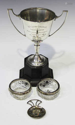 A George V silver two-handled trophy cup, Birmingham 1934, together with a silver caddy spoon,