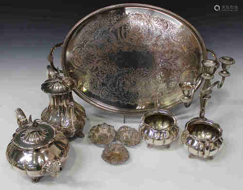 An early 20th century plated four-piece tea set of melon form with bird finials, comprising