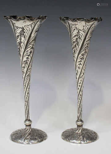 A pair of late Victorian silver specimen vases, each tapering spiral reeded body decorated with