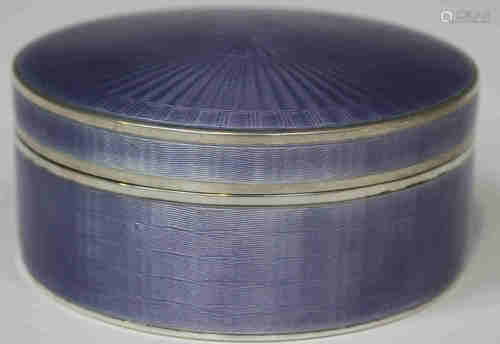 A George V silver and lilac enamelled circular box and cover with radiating engine turned