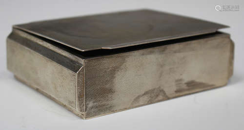 An Elizabeth II silver rectangular engine turned cigarette box, Birmingham 1960 by Mappin & Webb,