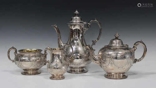 A Victorian silver four-piece tea set, each decorated in relief with oval panels filled with