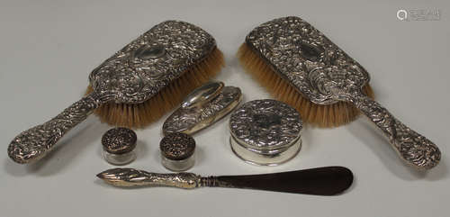 A late Victorian silver cylindrical ring box, the lid embossed with foliate scrolls, Chester 1900,