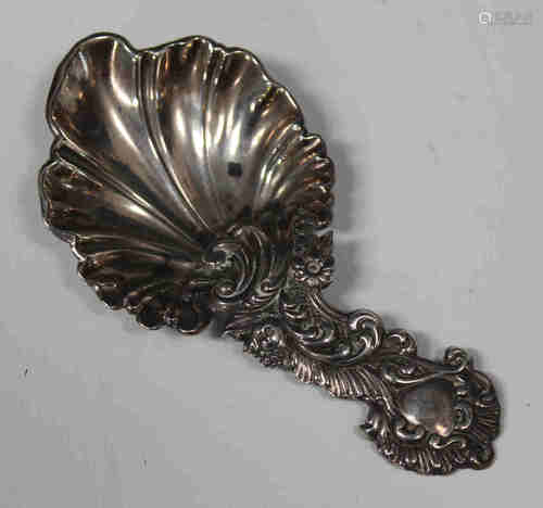 A Victorian silver caddy spoon of rococo scroll moulded form, Sheffield 1857 by Martin Hall & Co,