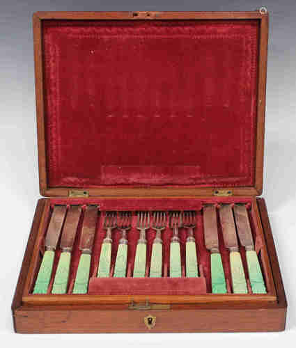 A set of Victorian silver and green stained ivory handled fruit knives and forks, comprising