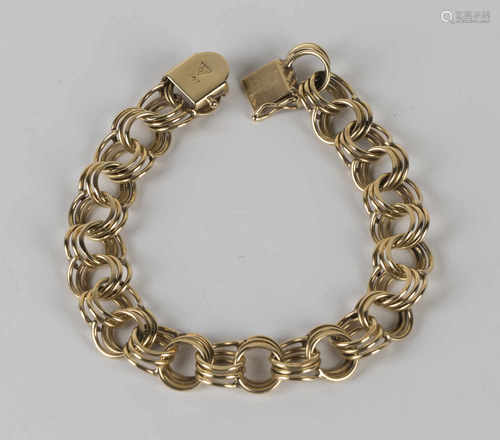 A gold bracelet in a circular triple twist link design, on a snap clasp, detailed '14K', length