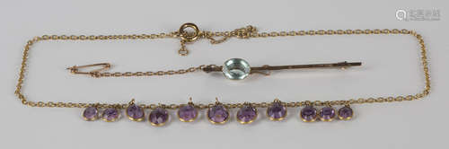 A gold and amethyst necklace, the front mounted with a row of eleven graduated oval cut amethysts,