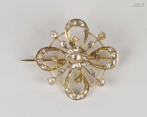 A European gold and rose cut diamond brooch, circa 1900, in a pierced quatrefoil openwork design