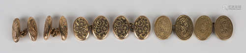 A pair of 9ct gold oval cufflinks with scroll engraved decoration, a pair of late Victorian 9ct gold