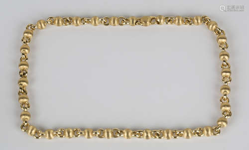 An 18ct gold necklace in a circular and textured bead link design, on a sprung hook shaped clasp,