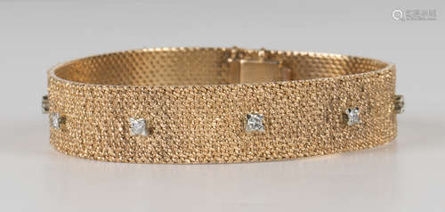 A gold and diamond bracelet, mounted with ten circular cut diamonds on a textured ground, on a