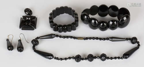 A collection of Victorian black mourning jewellery, including some jet pieces, comprising a pair