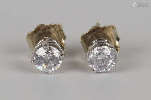 A pair of 14ct white gold and clarity enhanced diamond single stone earstuds with post fittings,