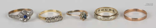 An 18ct gold and diamond set five stone ring, a 9ct gold wedding ring, a gold and silver, blue and