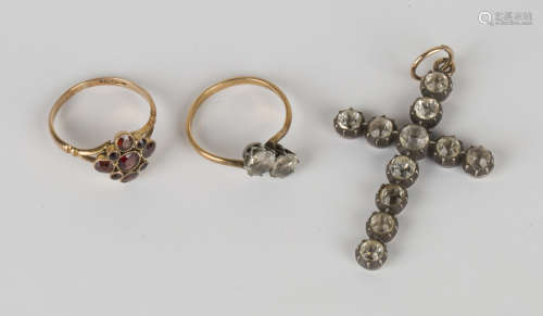 A gold and garnet nine stone cluster ring with split shoulders, detailed '9ct', ring size approx