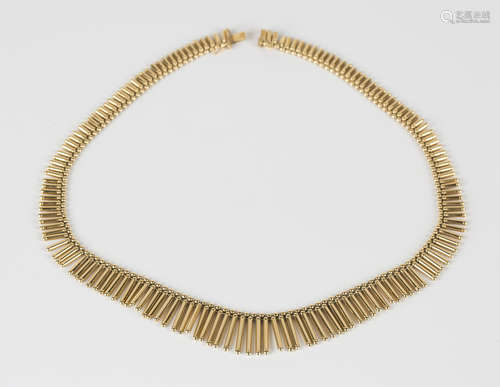 An 18ct gold graduated fringe necklace on a snap clasp, length 46cm.Buyer’s Premium 29.4% (including