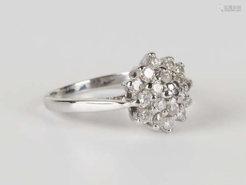 An 18ct white gold and diamond cluster ring, mounted with circular cut diamonds, detailed 'Dia 075',