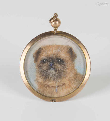 A gold mounted circular pendant locket, detailed '9ct', glazed with a painted portrait miniature