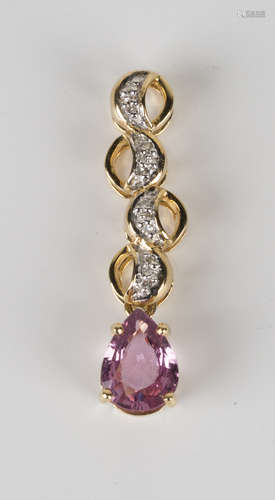 An 18ct gold, pink sapphire and diamond pendant, claw set with the pear shaped pink sapphire to