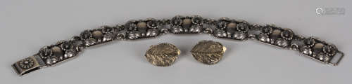An N.E. From silver bracelet, the links of rectangular form with floral and foliate decoration,