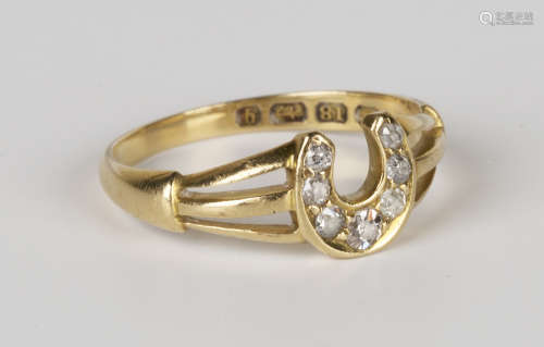 A Victorian 18ct gold and diamond ring, mounted with seven cushion shaped diamonds to the