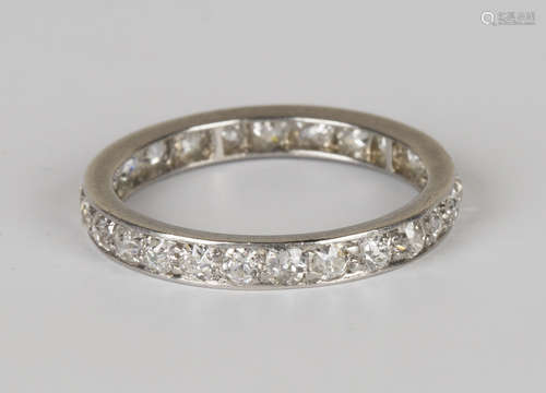 A platinum and diamond eternity ring, set with circular cut diamonds, ring size approx M1/2, total