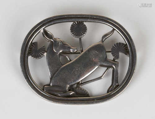 A Georg Jensen sterling silver brooch, designed by Arno Malinowski as a deer with stylized flowers