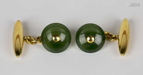 A pair of 9ct gold and nephrite cufflinks with circular nephrite fronts and 9ct gold torpedo