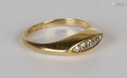 A gold and diamond five stone ring, mounted with a row of graduated cushion shaped diamonds in a