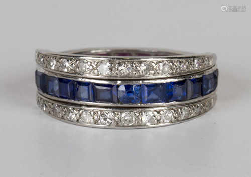 A platinum, sapphire, ruby and diamond swing eternity ring, the central band mounted with a row of