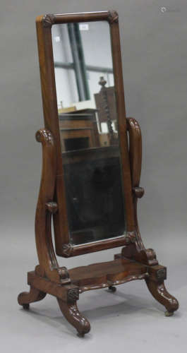 An early Victorian mahogany child's cheval mirror with carved foliate mouldings, on cabriole legs,