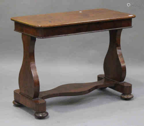 A Victorian mahogany centre table, the top with rounded corners, raised on lye-shaped supports