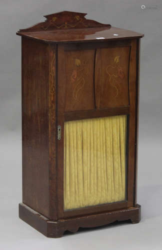 An Edwardian Art Nouveau mahogany music cabinet with foliate inlaid decoration, fitted with a glazed