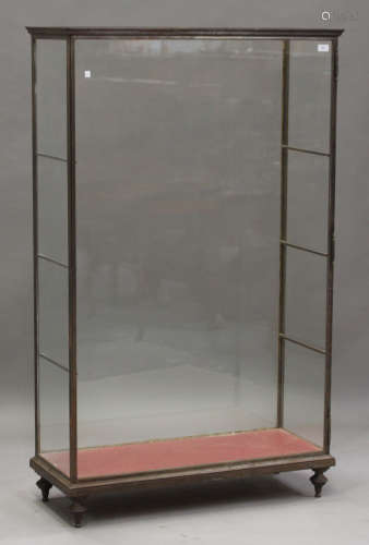 A mid-20th century French steel and glazed shop display cabinet, fitted with glass shelves, on