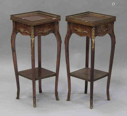 A pair of 20th century French mahogany lamp tables with gilt metal mounts, each fitted with a