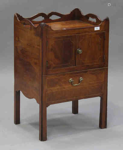 A late George III mahogany night table with boxwood stringing, the gallery top with pierced handles,