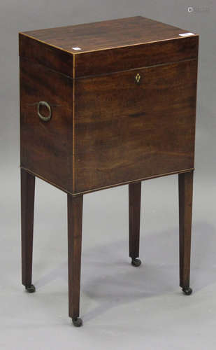 A George III mahogany cellarette with boxwood stringing, the hinged lid revealing a six-division