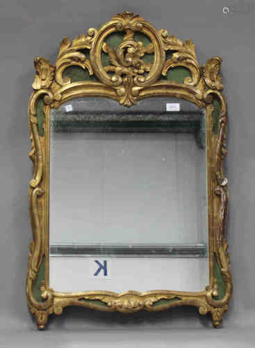 A 20th century French Rococo style giltwood and green painted wall mirror with carved foliate scroll