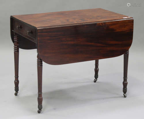 A Victorian figured mahogany Pembroke table, fitted with a frieze drawer, on turned legs and