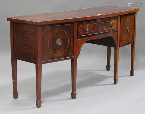 An early 20th century George III style mahogany bowfront sideboard, fitted with a cupboard and two