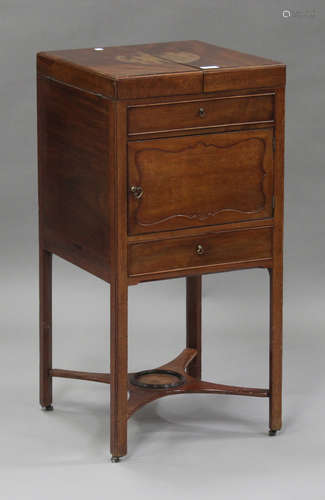 A George III mahogany gentleman's washstand, the double hinged top above a cupboard and a drawer,