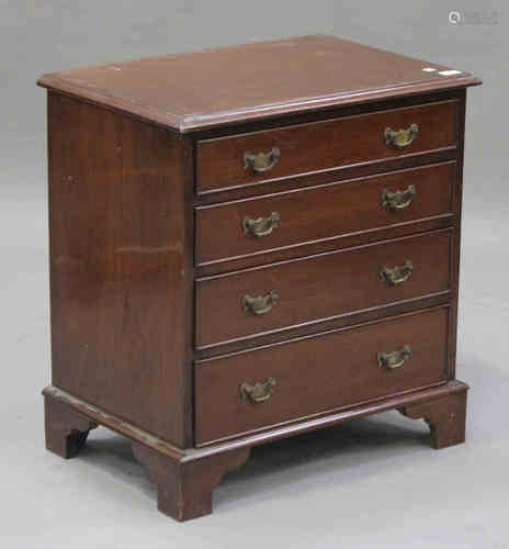 An early 20th century George III style mahogany chest of four graduated long drawers, on bracket