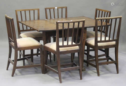 A set of six early 19th century oak rail back dining chairs with drop-in seats, on square tapering